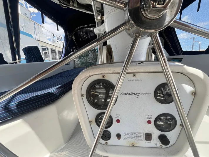Bella Vita Yacht Photos Pics Steering wheel and control panel of a 1999 Catalina 42 MkII yacht.
