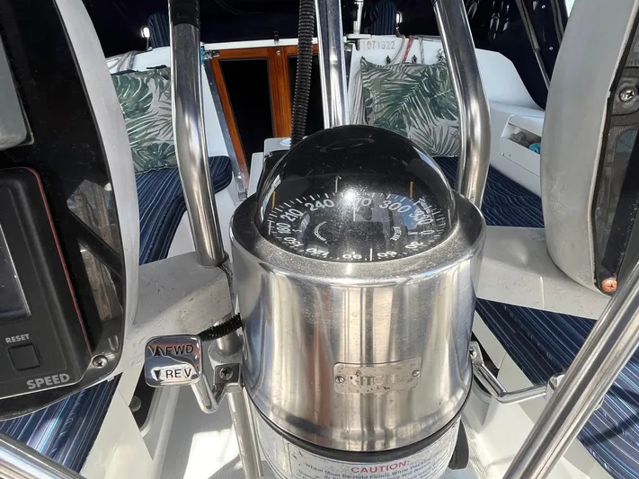 Bella Vita Yacht Photos Pics Compass and controls on a 1999 Catalina 42 MkII sailboat cockpit.