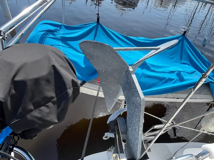 Bella Vita Yacht Photos Pics Sailboat anchor and blue tarp on 1999 Catalina 42 MkII at marina.