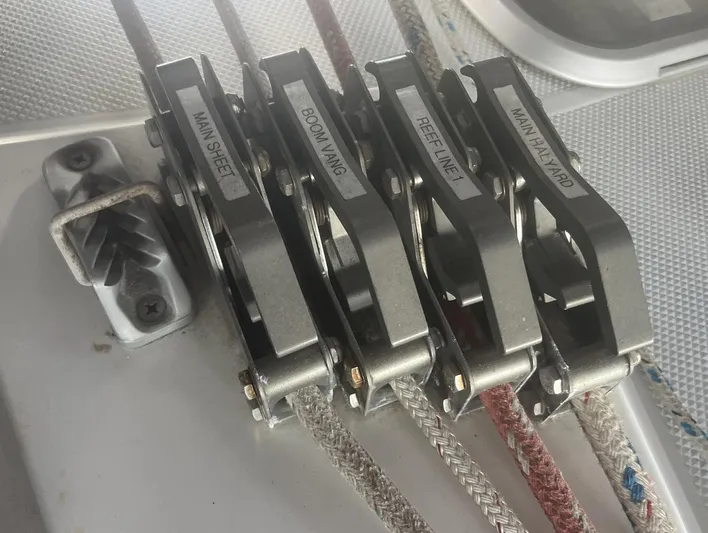 Bella Vita Yacht Photos Pics Sailboat control lines labeled: Main Sheet, Boom Vang, Reef Line, Main Halyard on Catalina 42 MkII.