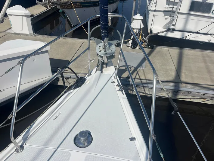 Bella Vita Yacht Photos Pics Bow of a 1999 Catalina 42 MkII sailboat docked at a marina.
