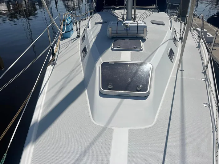 Bella Vita Yacht Photos Pics 1999 Catalina 42 MkII sailboat deck with hatches and rigging, docked at marina.