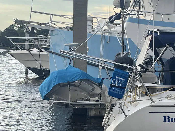 Bella Vita Yacht Photos Pics Catalina 42 MkII sailboat docked with covered dinghy and lifesaving equipment.