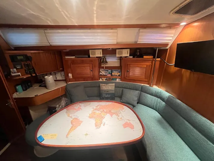 Bella Vita Yacht Photos Pics Cozy interior of 1999 Catalina 42 MkII sailboat with map table and cushioned seating.