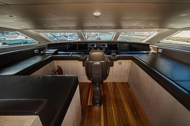 Percal Yacht Photos Pics Luxurious helm of 2014 Sanlorenzo SL104 yacht with panoramic windows and modern controls.