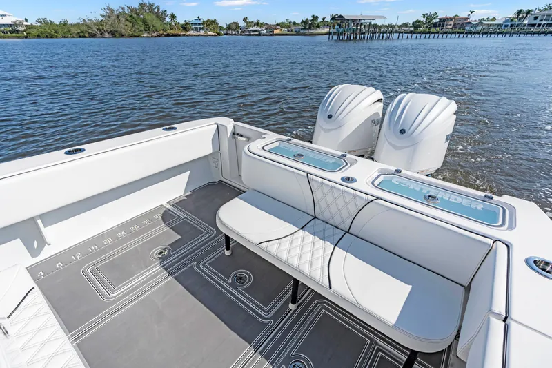 32st Fbmg Custom Edition Yacht Photos Pics 2024 Contender 32 ST boat interior with dual engines on a calm lake.