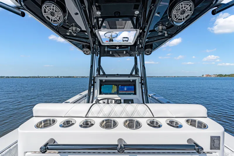 32st Fbmg Custom Edition Yacht Photos Pics 2024 Contender 32 ST boat interior with advanced navigation system on open water.
