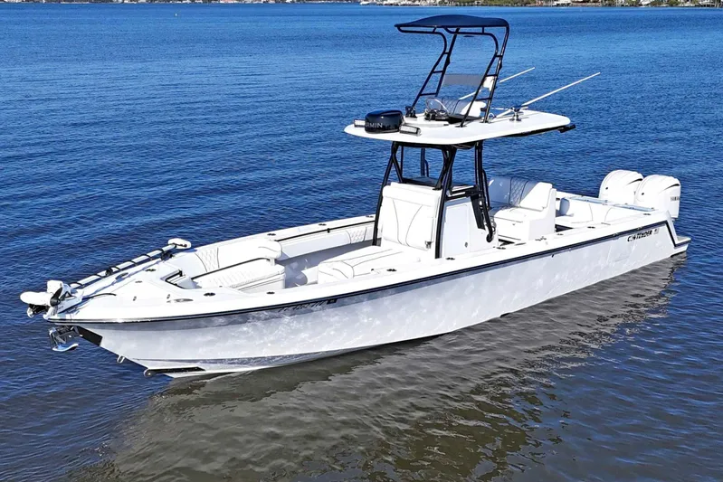 32st Fbmg Custom Edition Yacht Photos Pics 2024 Contender 32 ST boat on calm blue water, featuring sleek design and modern equipment.