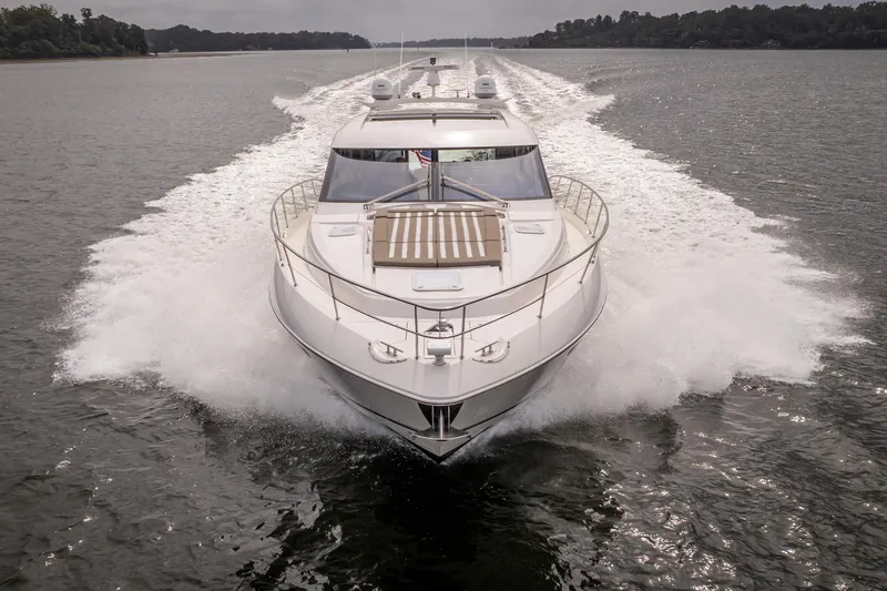 Change Happens Yacht Photos Pics 2017 Riviera 6000 Sport Yacht cruising on a calm waterway.