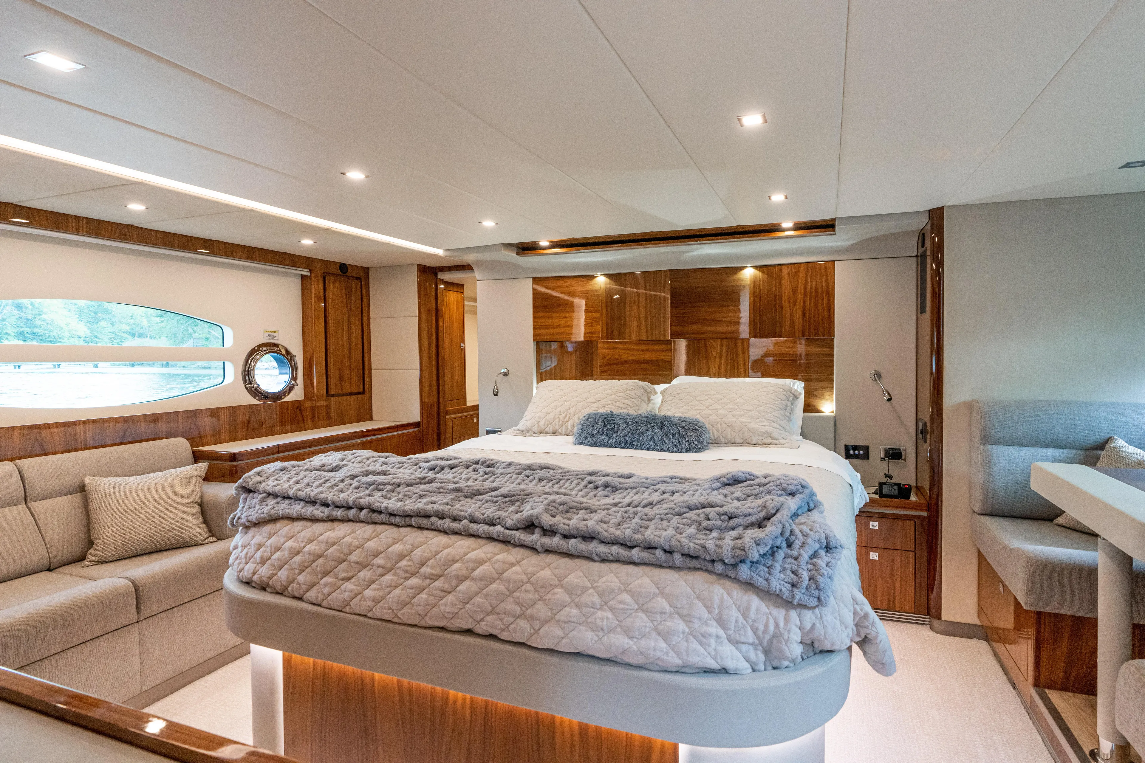 Change Happens Yacht Photos Pics Luxurious interior of 2017 Riviera 6000 Sport Yacht with elegant bedroom and seating area.