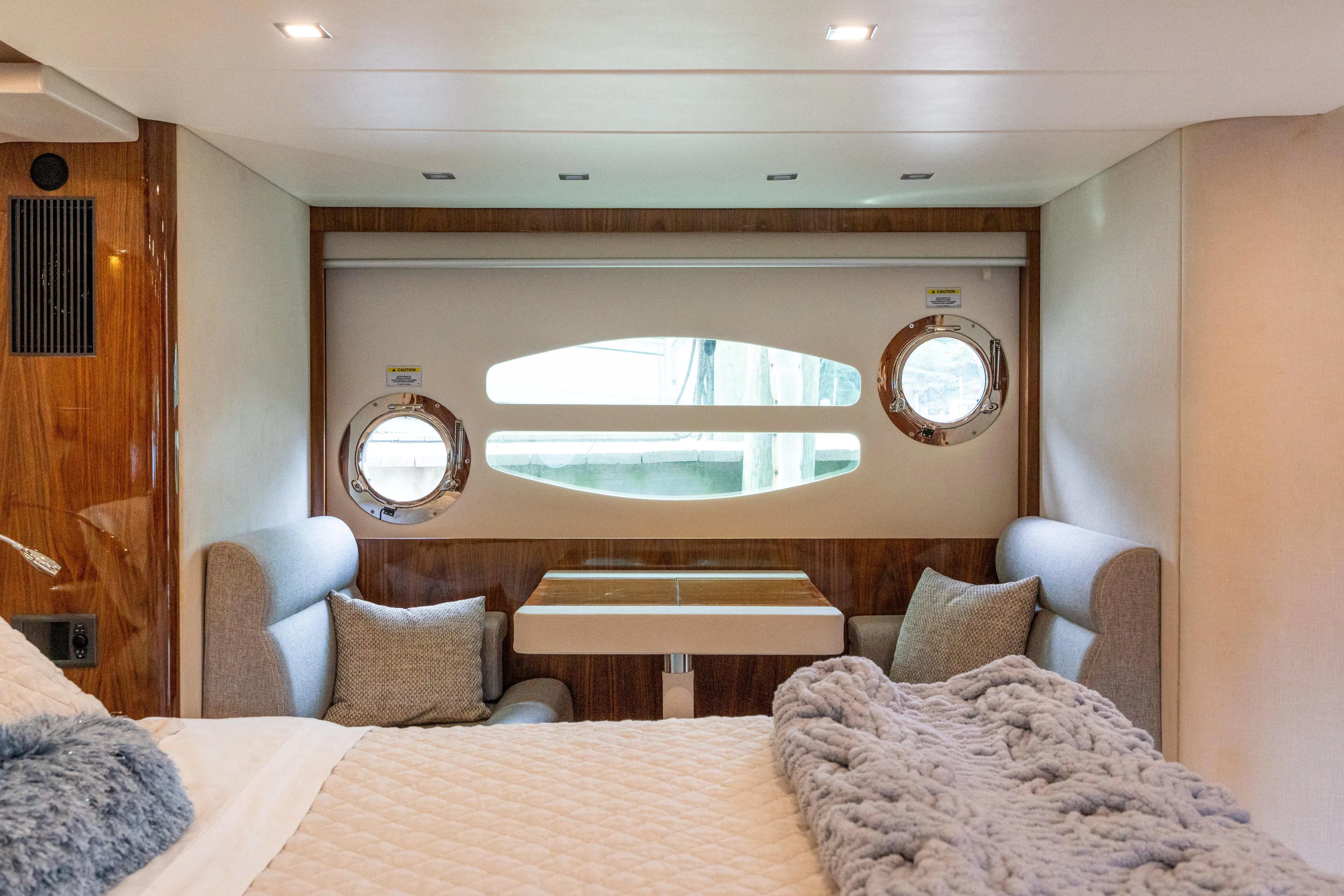 Change Happens Yacht Photos Pics Luxurious interior of 2017 Riviera 6000 Sport Yacht with cozy seating and elegant decor.