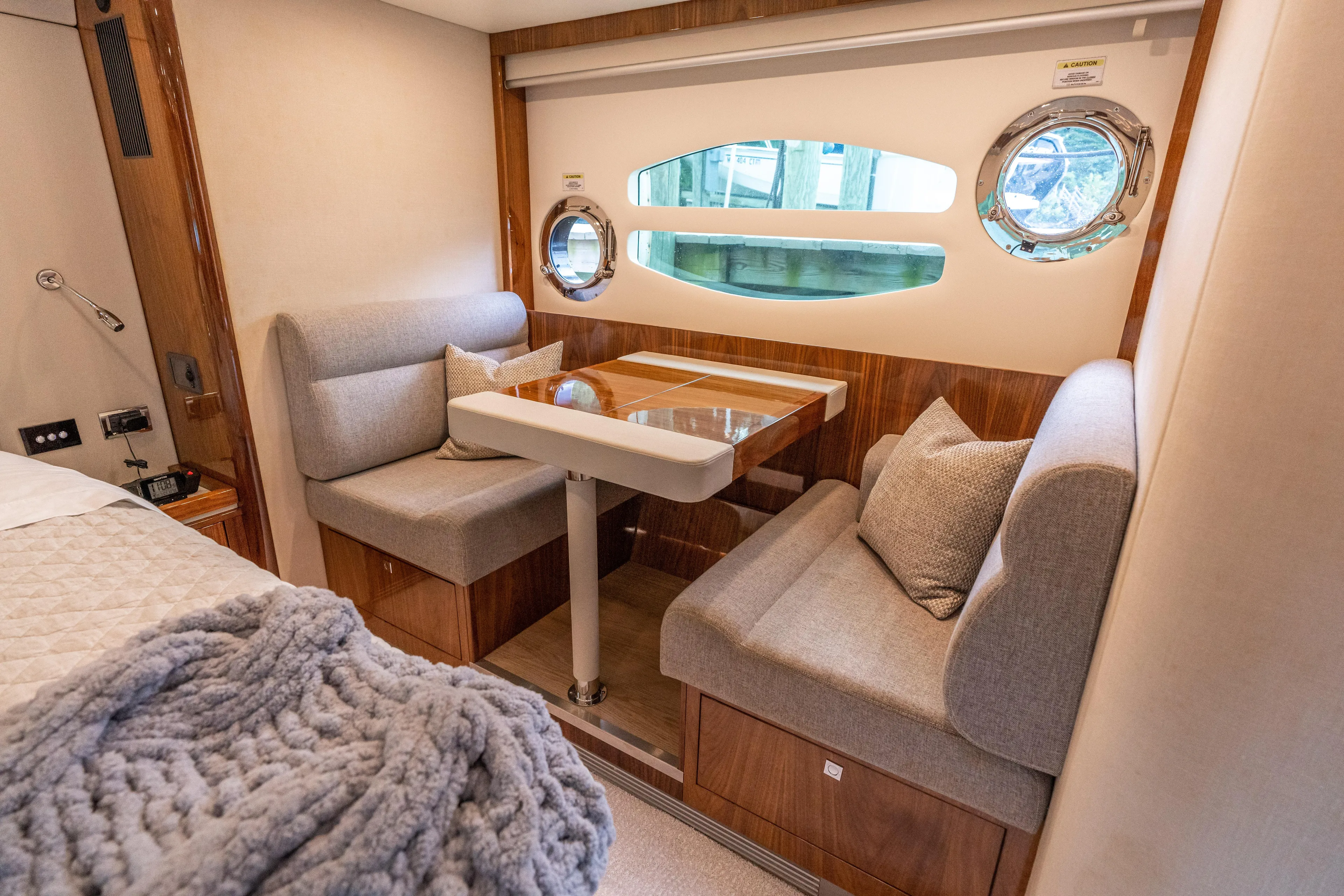 Change Happens Yacht Photos Pics Luxurious interior of 2017 Riviera 6000 Sport Yacht with cozy seating and elegant decor.