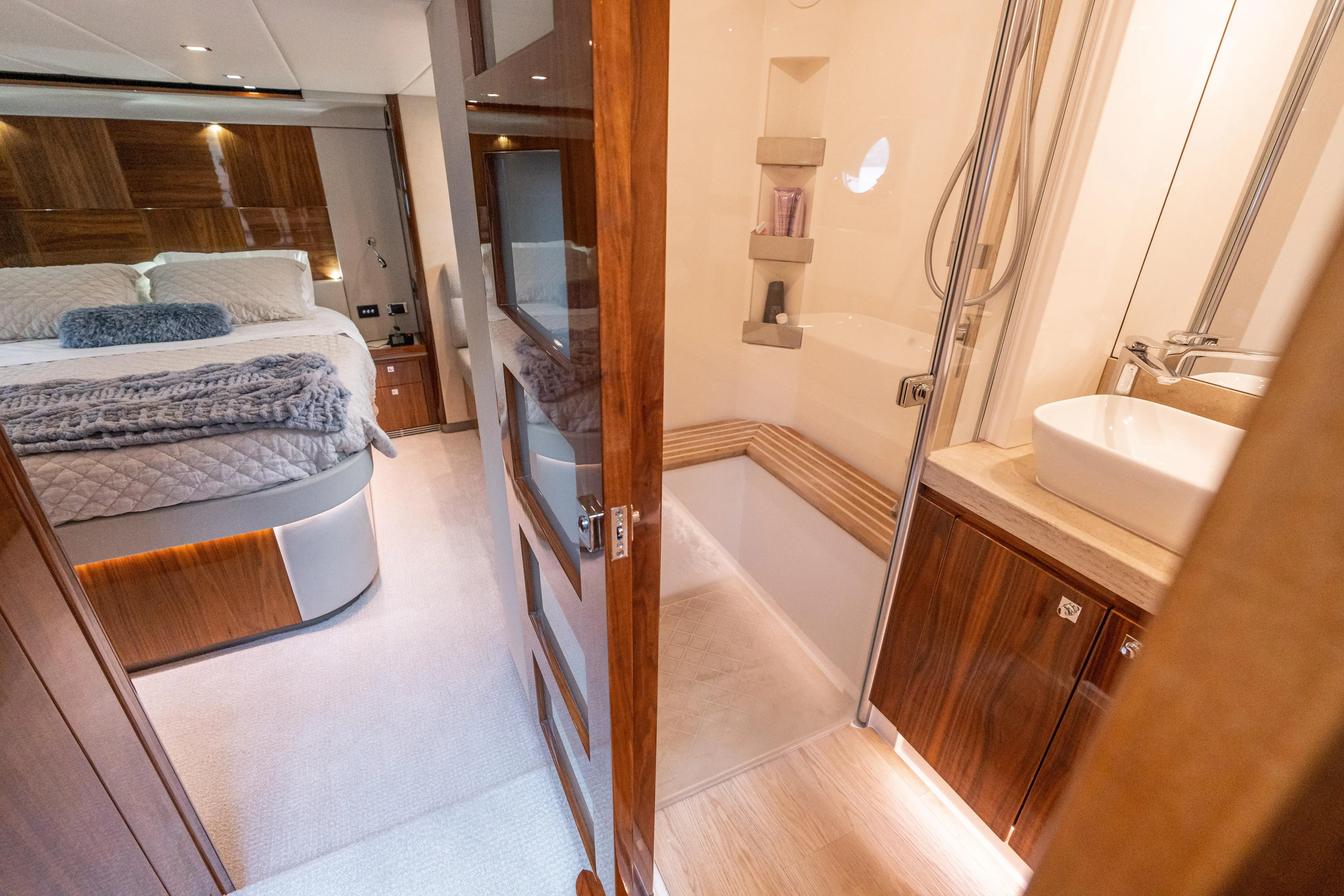 Change Happens Yacht Photos Pics Luxurious interior of 2017 Riviera 6000 Sport Yacht with bedroom and bathroom.