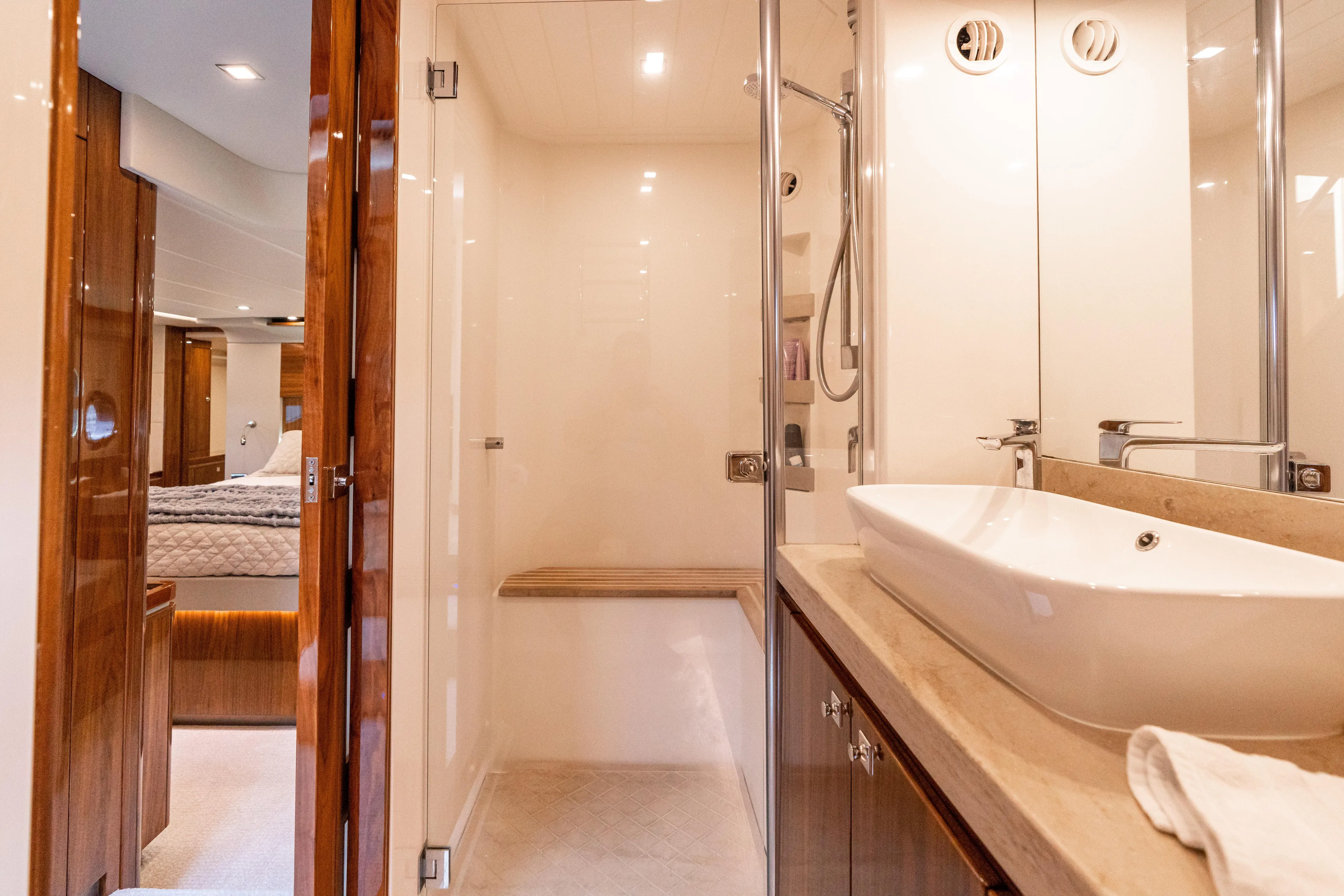 Change Happens Yacht Photos Pics Luxurious bathroom interior of 2017 Riviera 6000 Sport Yacht with modern fixtures and elegant design.