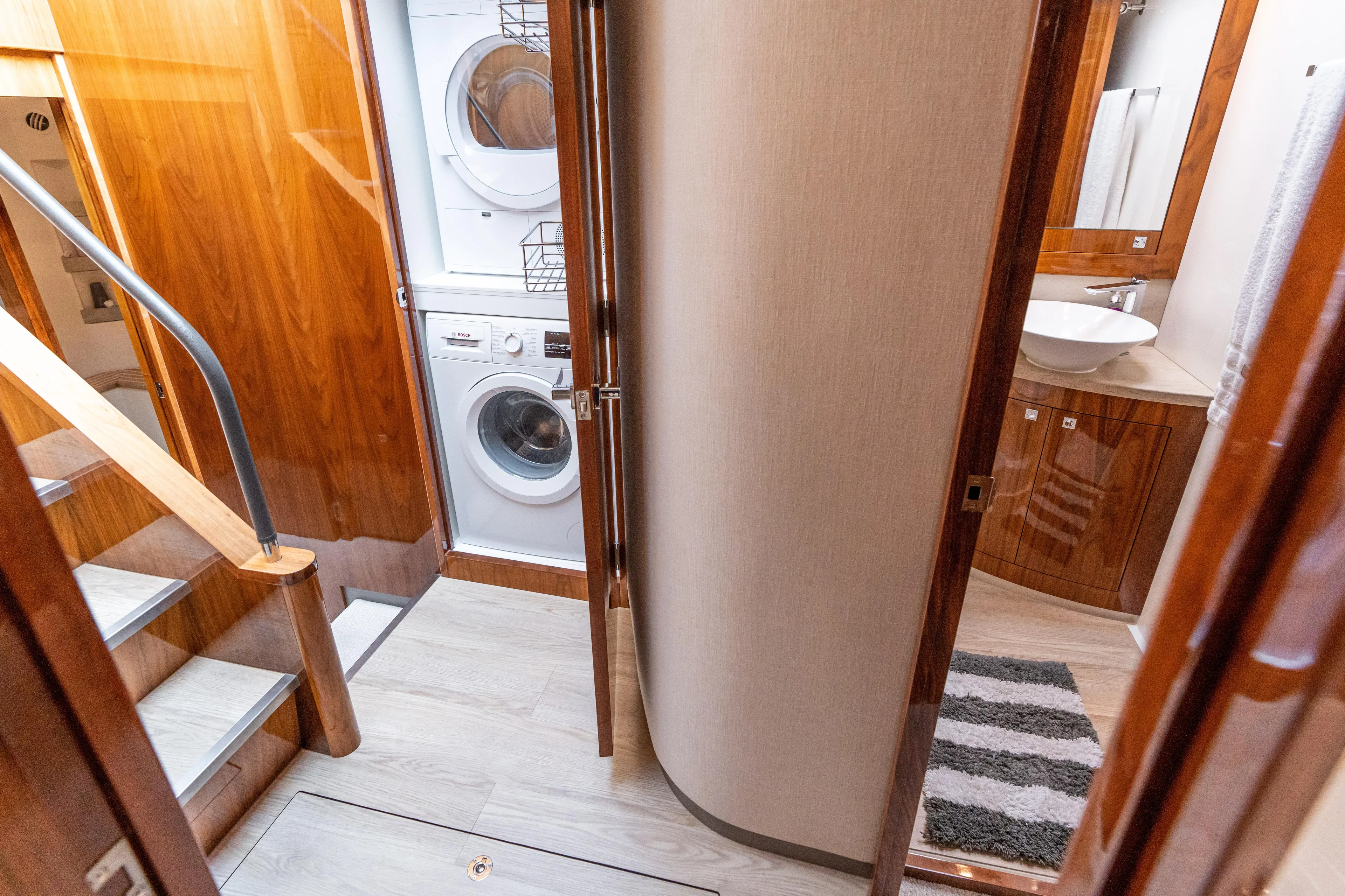 Change Happens Yacht Photos Pics Interior of 2017 Riviera 6000 Sport Yacht with laundry area and bathroom.