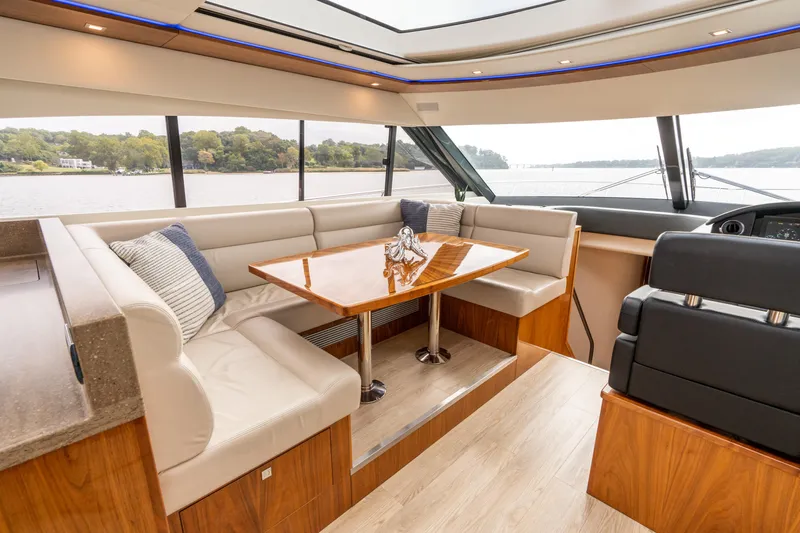 Change Happens Yacht Photos Pics Luxurious interior of 2017 Riviera 6000 Sport Yacht with elegant seating and scenic views.