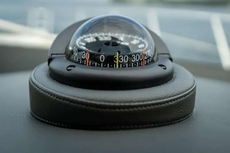 Change Happens Yacht Photos Pics Compass on 2017 Riviera 6000 Sport Yacht dashboard, close-up view.
