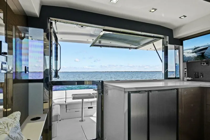 Perfect Match Yacht Photos Pics Interior view of 2018 Cruisers Yachts 45 Cantius, featuring modern kitchen and ocean backdrop.