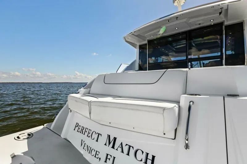 Perfect Match Yacht Photos Pics 2018 Cruisers Yachts 45 Cantius on open water, rear view with seating.