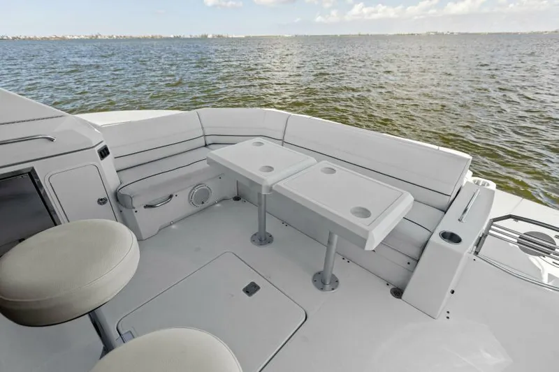 Perfect Match Yacht Photos Pics 2018 Cruisers Yachts 45 Cantius deck with seating and tables, overlooking water.