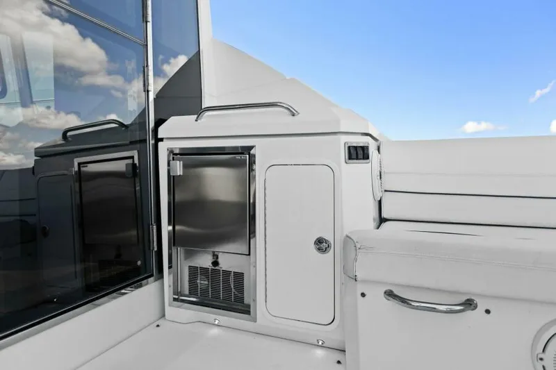 Perfect Match Yacht Photos Pics 2018 Cruisers Yachts 45 Cantius cockpit with sleek cabinetry and stainless steel accents.