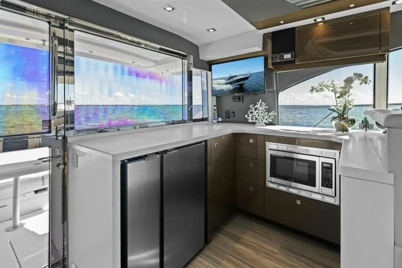 Perfect Match Yacht Photos Pics Luxurious 2018 Cruisers Yachts 45 Cantius kitchen with ocean view, modern appliances, and sleek design.