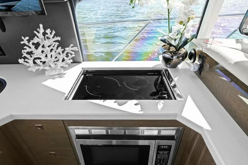 Perfect Match Yacht Photos Pics Luxurious 2018 Cruisers Yachts 45 Cantius kitchen with modern appliances and elegant decor.