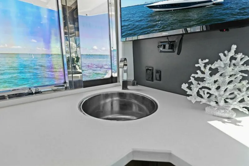 Perfect Match Yacht Photos Pics Luxury yacht interior with sink, coral decor, and ocean view; 2018 Cruisers Yachts 45 Cantius.