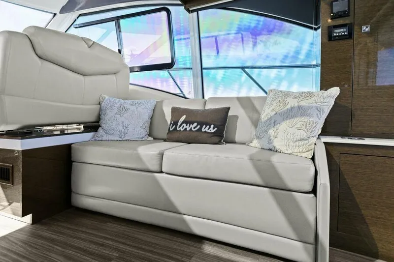 Perfect Match Yacht Photos Pics Luxurious interior of 2018 Cruisers Yachts 45 Cantius with cozy seating and decorative pillows.