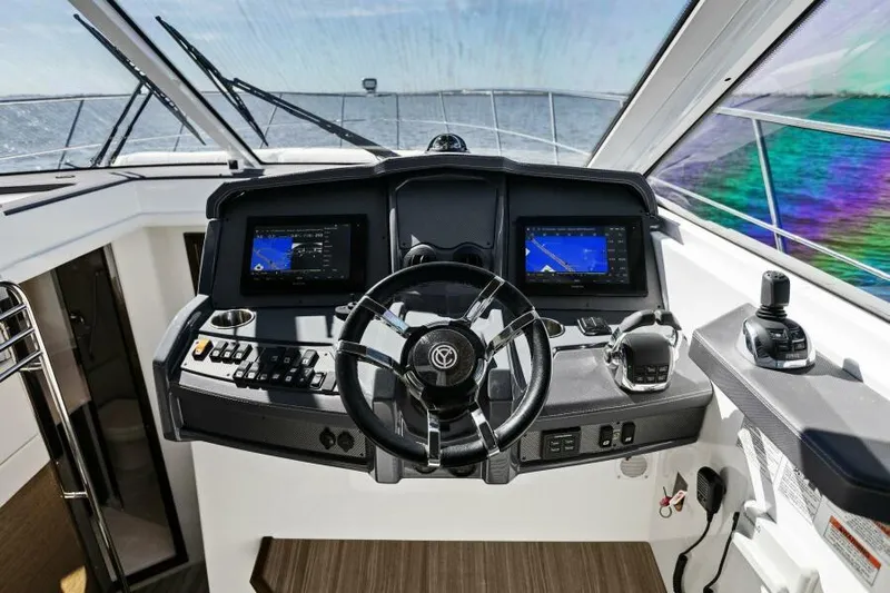 Perfect Match Yacht Photos Pics 2018 Cruisers Yachts 45 Cantius helm with dual navigation screens and steering wheel.