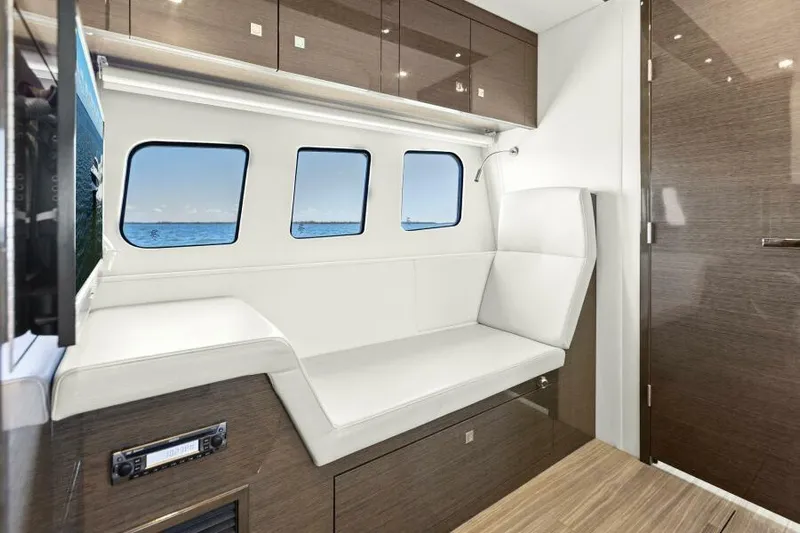 Perfect Match Yacht Photos Pics Luxurious interior of 2018 Cruisers Yachts 45 Cantius with sleek seating and ocean view windows.