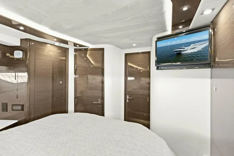 Perfect Match Yacht Photos Pics Luxurious interior of 2018 Cruisers Yachts 45 Cantius with modern design and TV.