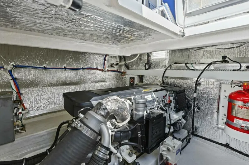 Perfect Match Yacht Photos Pics Engine room of 2018 Cruisers Yachts 45 Cantius with fire extinguisher and insulation.