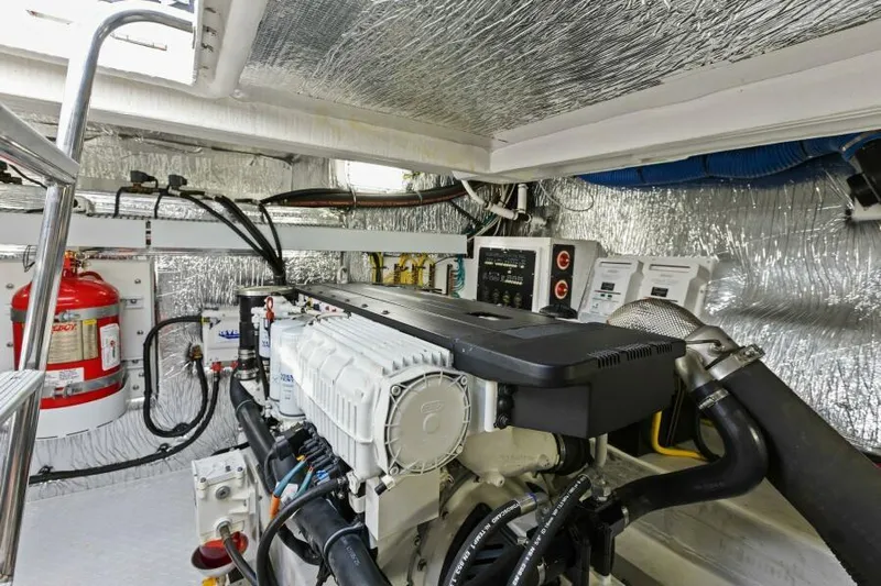 Perfect Match Yacht Photos Pics Engine room of 2018 Cruisers Yachts 45 Cantius with modern equipment and fire extinguisher.