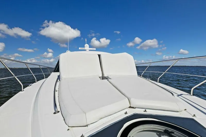 Perfect Match Yacht Photos Pics 2018 Cruisers Yachts 45 Cantius deck with sun pads, ocean view, blue sky.