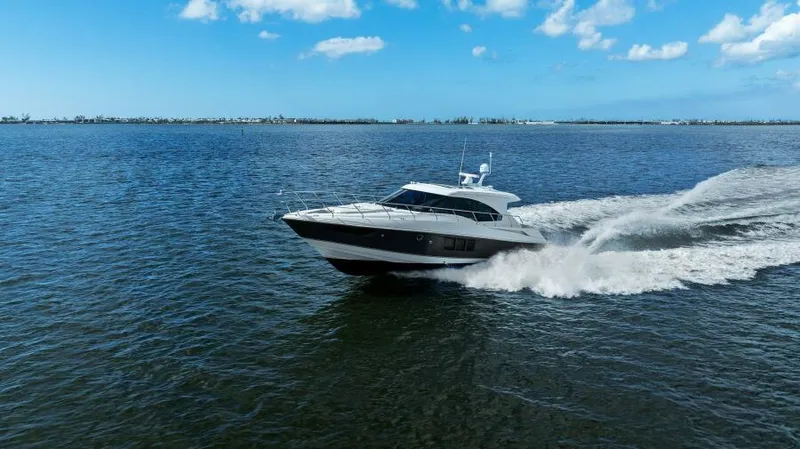 Perfect Match Yacht Photos Pics 2018 Cruisers Yachts 45 Cantius cruising on open water under a clear blue sky.