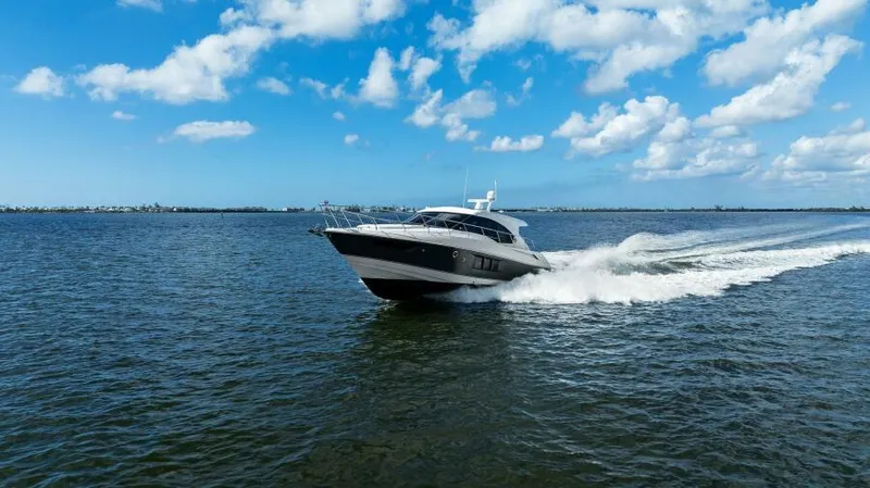 Perfect Match Yacht Photos Pics 2018 Cruisers Yachts 45 Cantius cruising on open water under a blue sky.