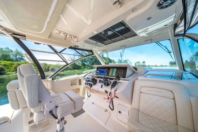  Yacht Photos Pics 2019 Grady-White Express boat interior with modern helm and luxurious seating.
