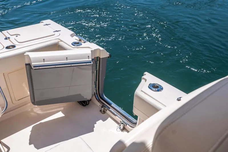  Yacht Photos Pics 2019 Grady-White Express boat deck with open transom door, overlooking blue water.