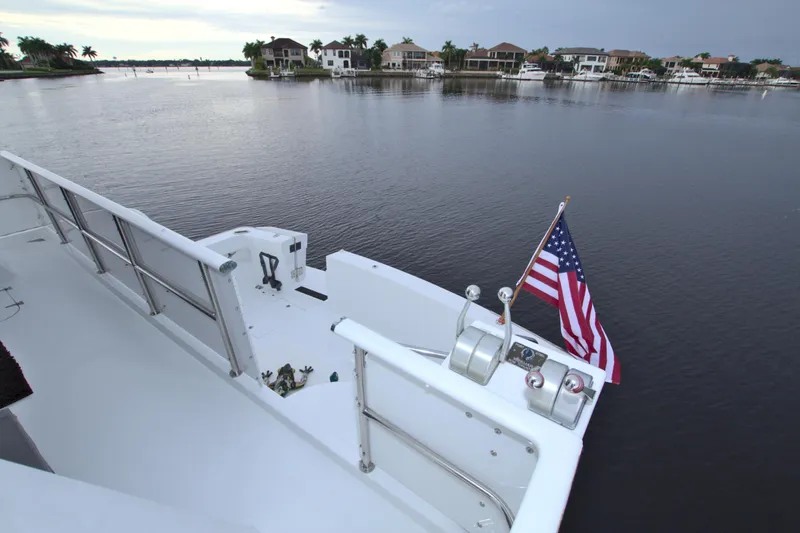 Cleodora Yacht Photos Pics View from the deck of a 1988 Viking 63 Cockpit Motor Yacht with an American flag.
