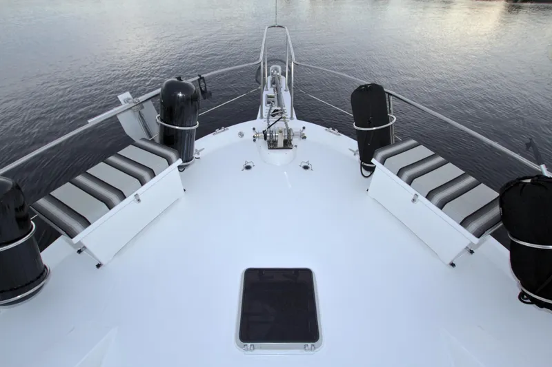 Cleodora Yacht Photos Pics Bow view of 1988 Viking 63 Cockpit Motor Yacht on calm water.