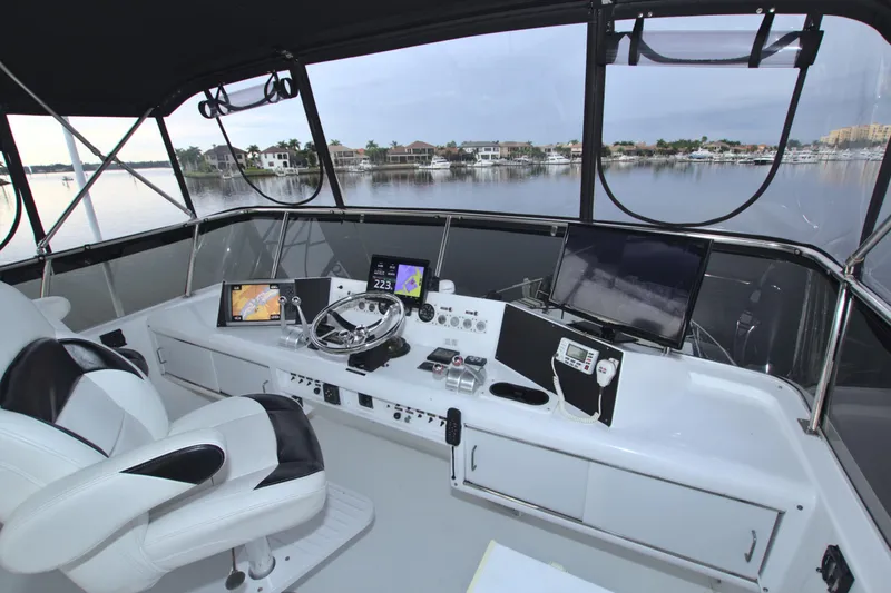 Cleodora Yacht Photos Pics 1988 Viking 63 Cockpit Motor Yacht helm with modern navigation equipment.