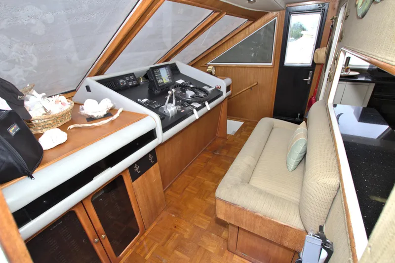 Cleodora Yacht Photos Pics 1988 Viking 63 Cockpit Motor Yacht interior with helm, seating, and navigation equipment.
