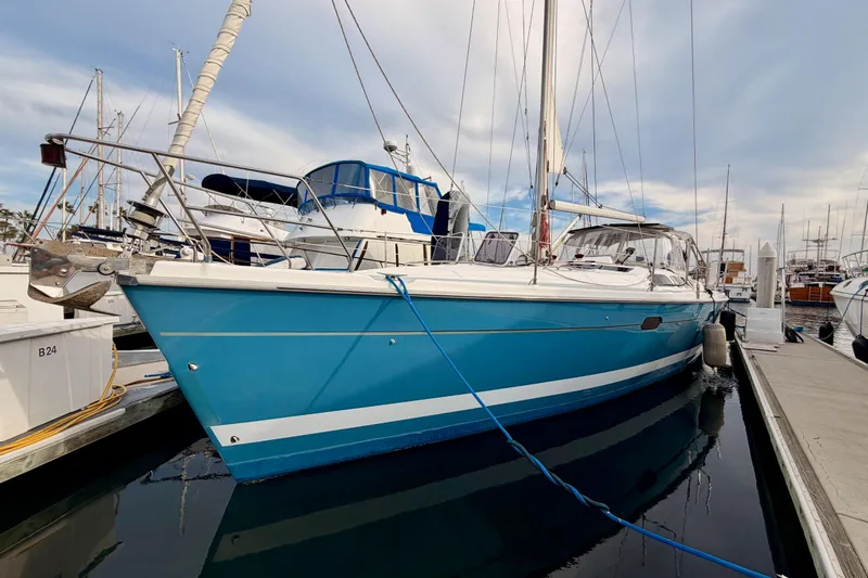 Serendipity II Yacht Photos Pics 2002 Hunter 460 sailboat docked in marina, featuring a sleek blue hull design.
