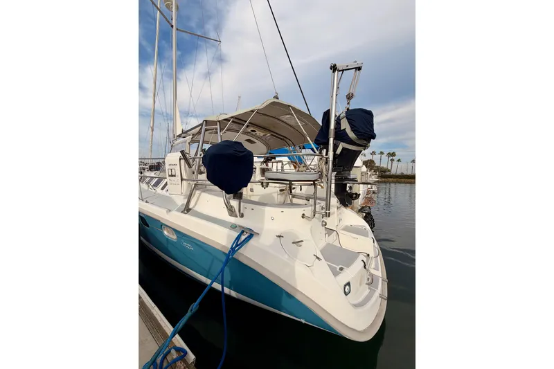 Serendipity II Yacht Photos Pics 2002 Hunter 460 sailboat docked, featuring a sleek design and blue hull.