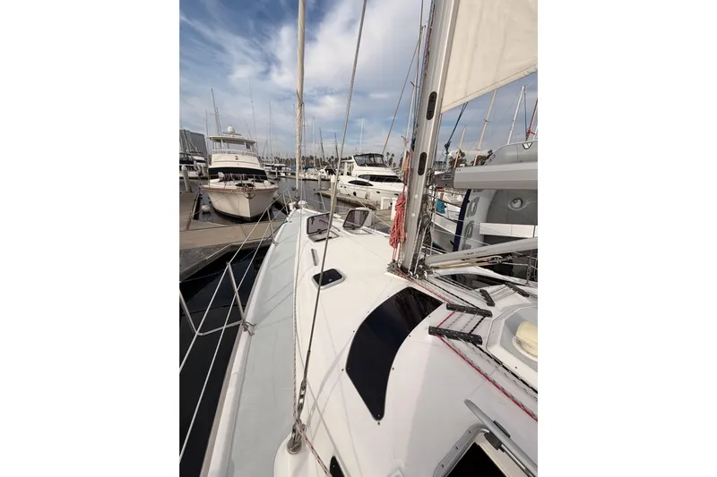Serendipity II Yacht Photos Pics Sailboat docked at marina, Hunter 460 model, 2002, with clear sky and surrounding boats.