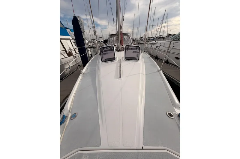 Serendipity II Yacht Photos Pics 2002 Hunter 460 sailboat deck view at marina, showcasing sleek design and rigging.
