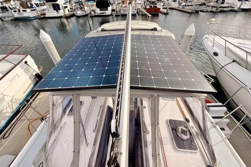 Serendipity II Yacht Photos Pics Hunter 460 sailboat with solar panels docked at marina, 2002 model.