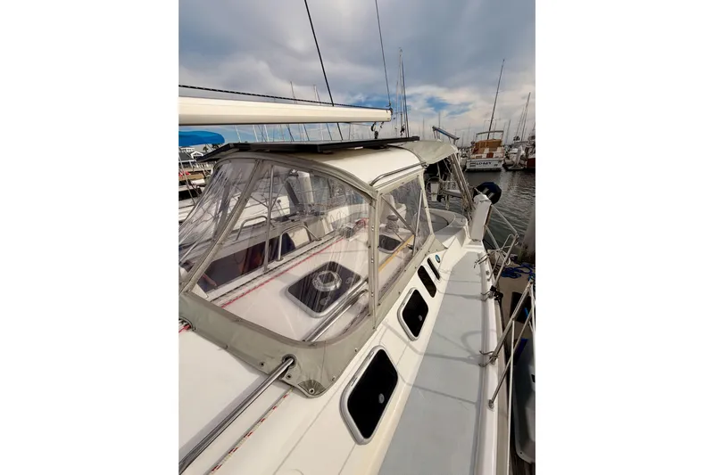 Serendipity II Yacht Photos Pics 2002 Hunter 460 sailboat docked at marina under cloudy sky.