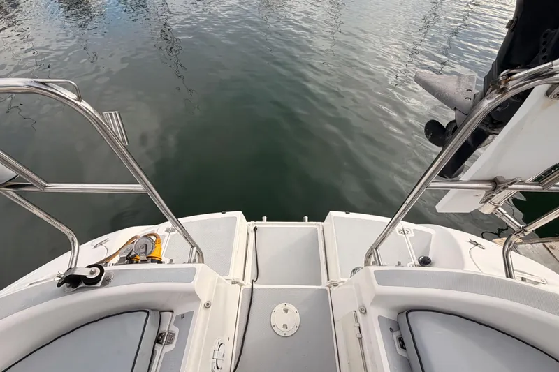 Serendipity II Yacht Photos Pics Rear view of a 2002 Hunter 460 sailboat with stainless steel railings.